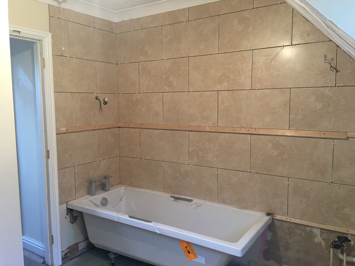 image shows: bathroom refurbishment corner bath joys green 