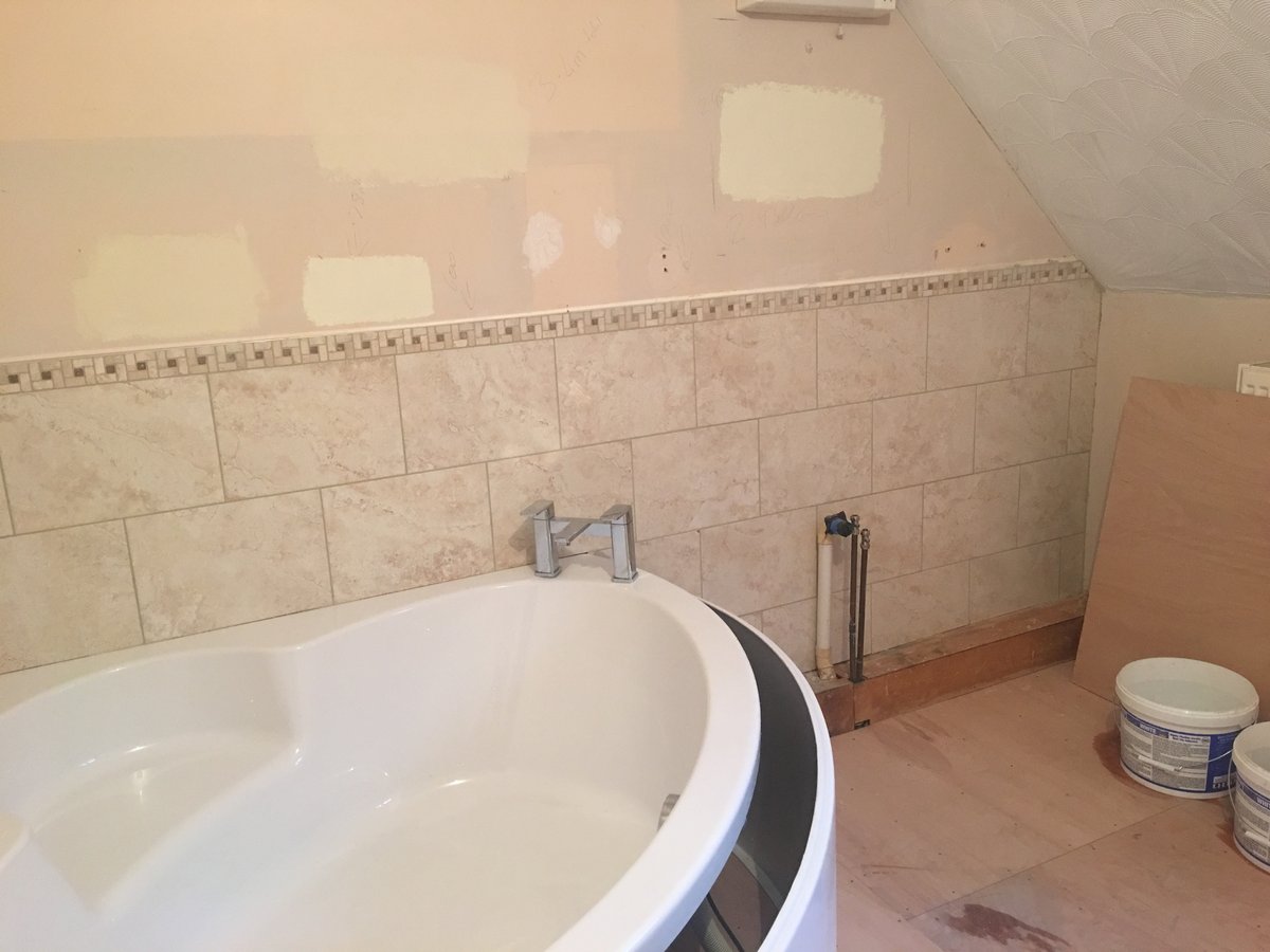 image shows: bathroom refurbishment corner bath joys green 