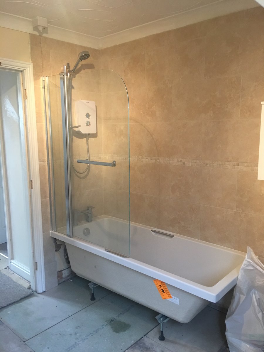 image shows: bathroom refurbishment corner bath joys green 