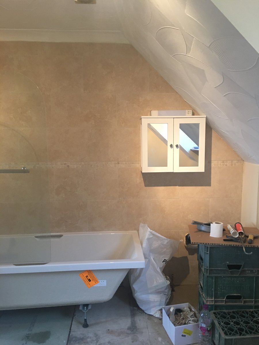 image shows: bathroom refurbishment corner bath joys green 