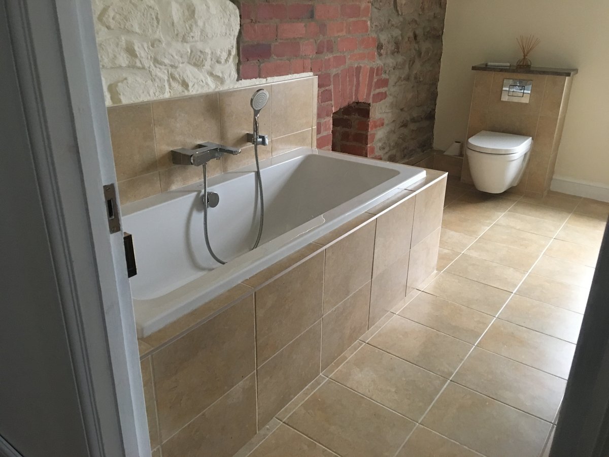 image shows: bathroom renovation stone floor mork 