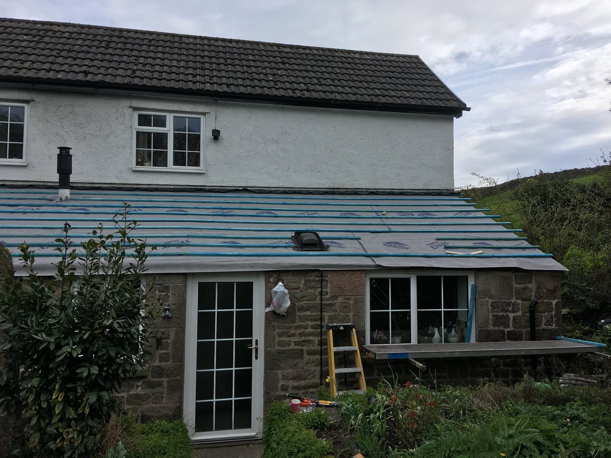 image shows: new roofing felt and battens velux window cleddon 