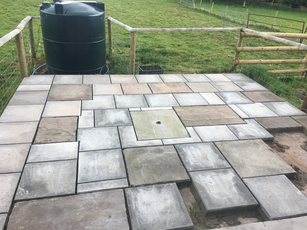 Click here to view the image of patio using mixed new old slabs trellech grange at higher resolution. An image of patio using mixed new old slabs trellech grange goes here.
