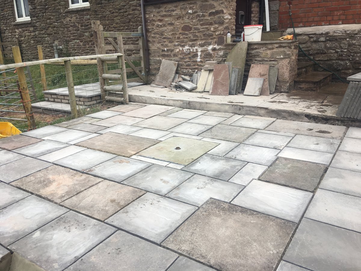 image shows: patio using mixed new old slabs trellech grange 