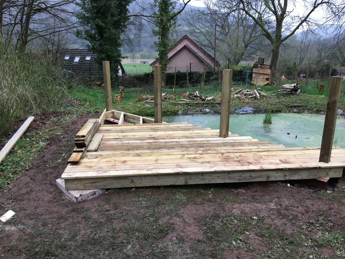 image shows: pond corner decking llandogo school 