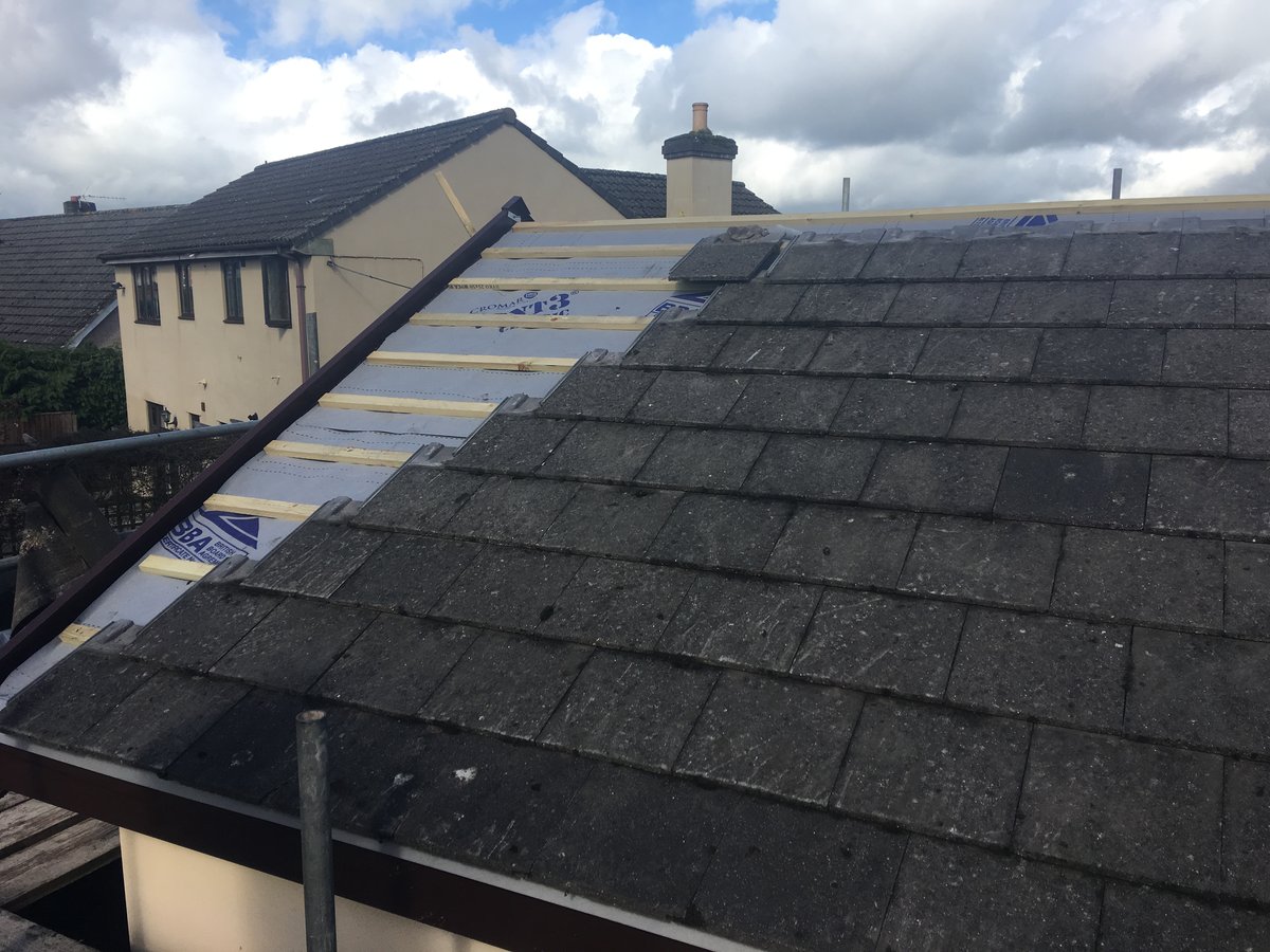 image shows: roof replacement using existing tiles bury hill 